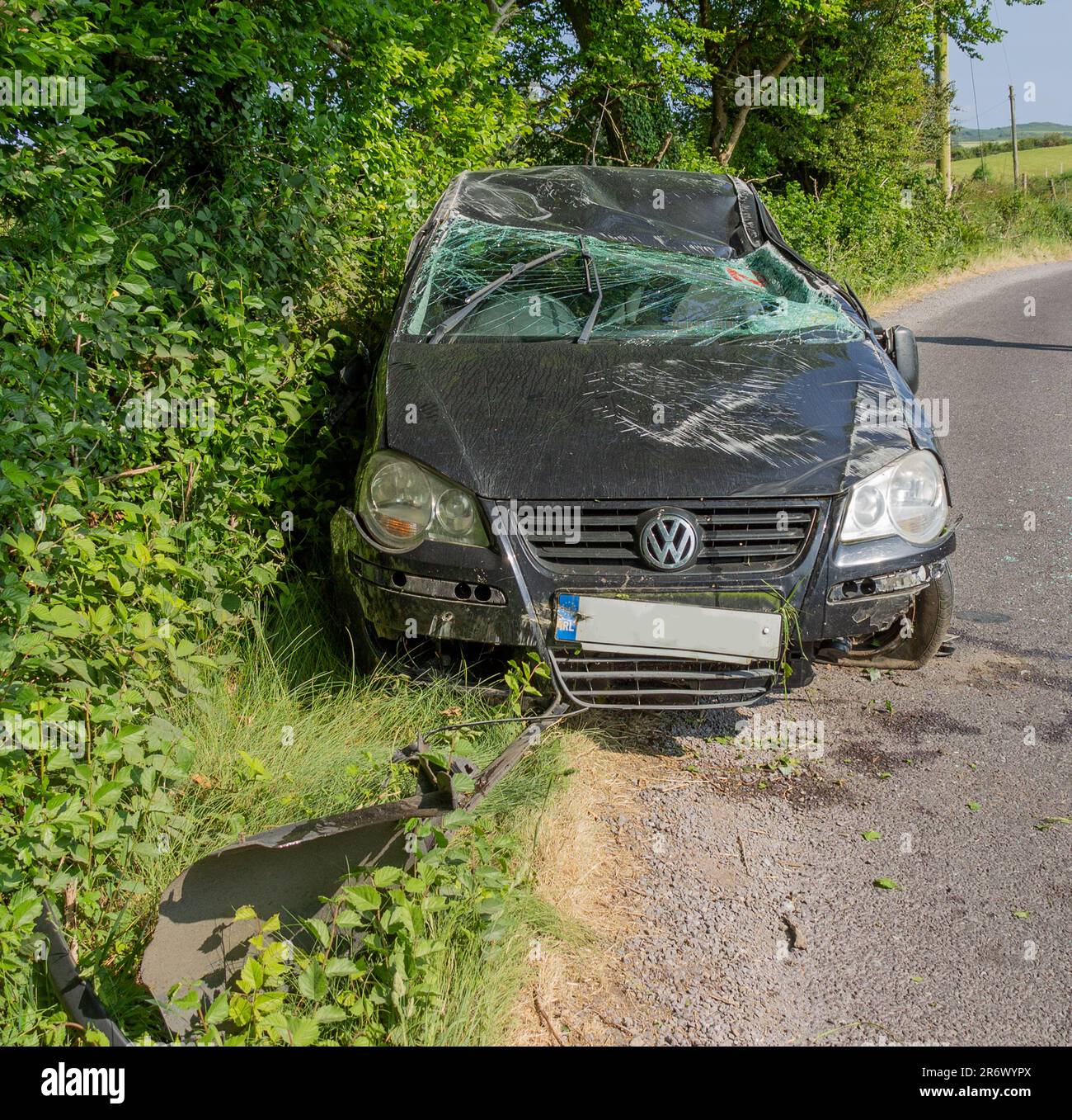 Badly damaged VW Golf after crash on roadside. Stock Photo