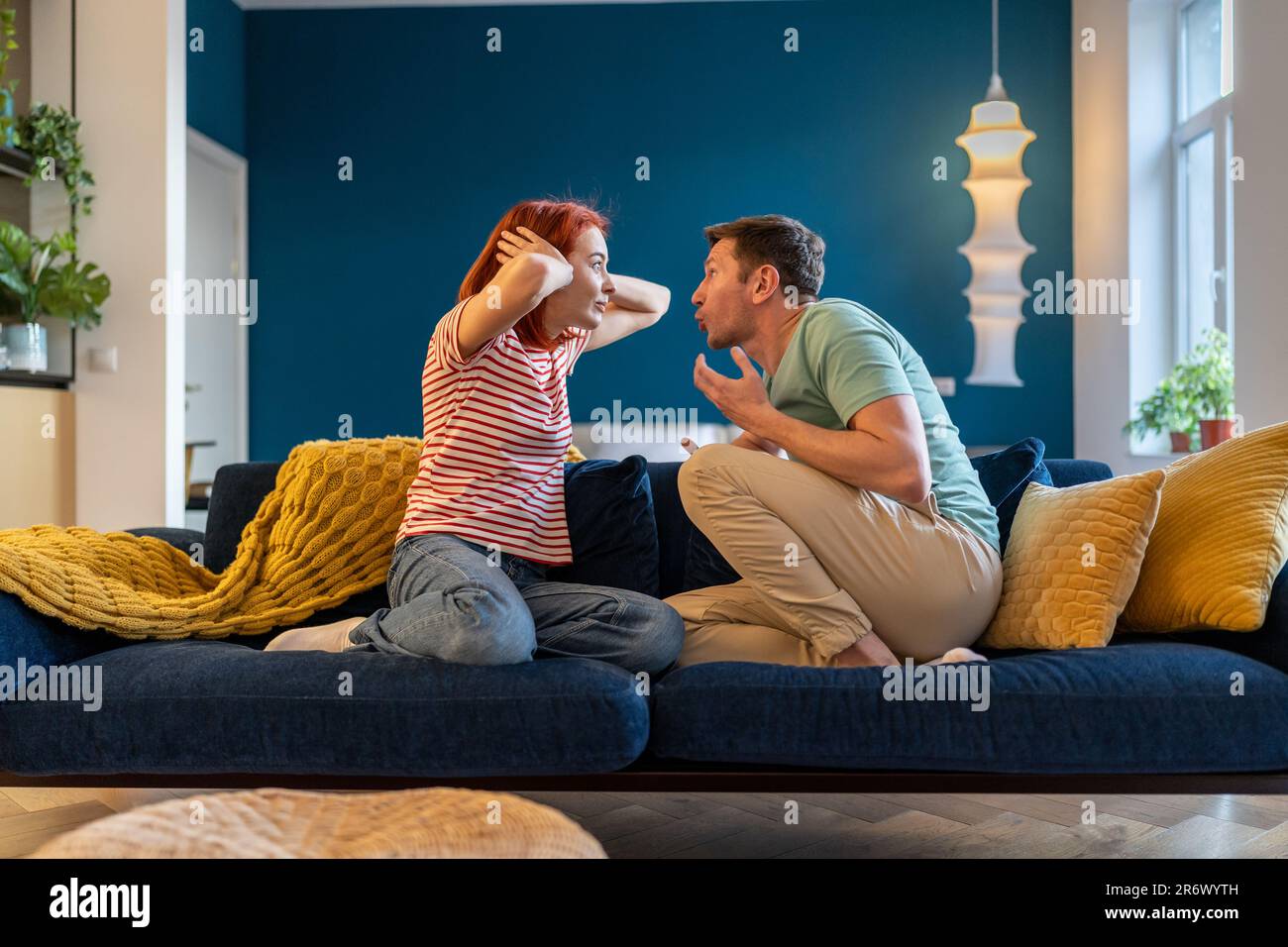 Angry annoyed man husband screaming at wife stock photo alamy