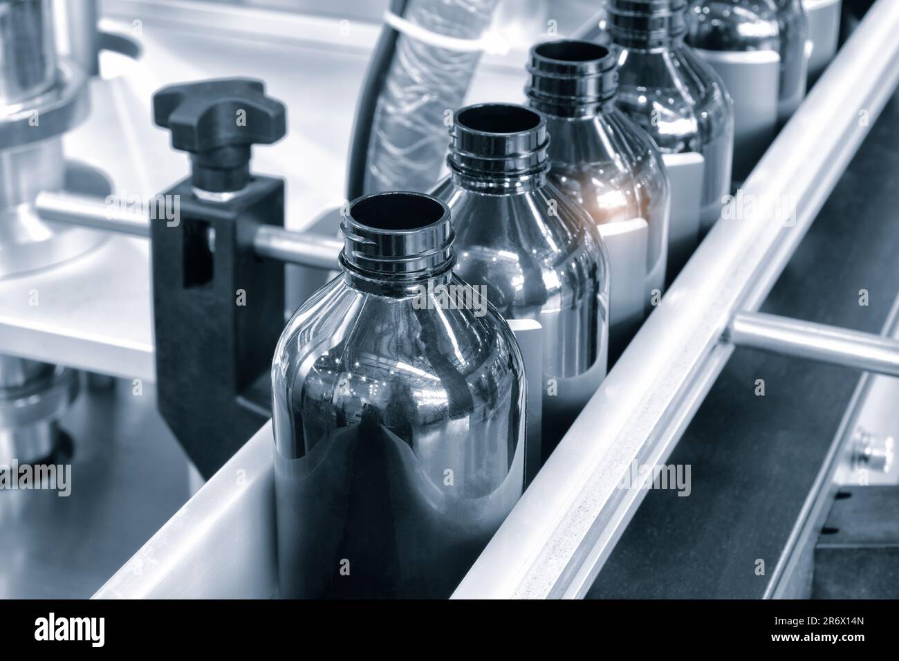 Bottle. Industrial production of plastic pet bottles. Factory line for