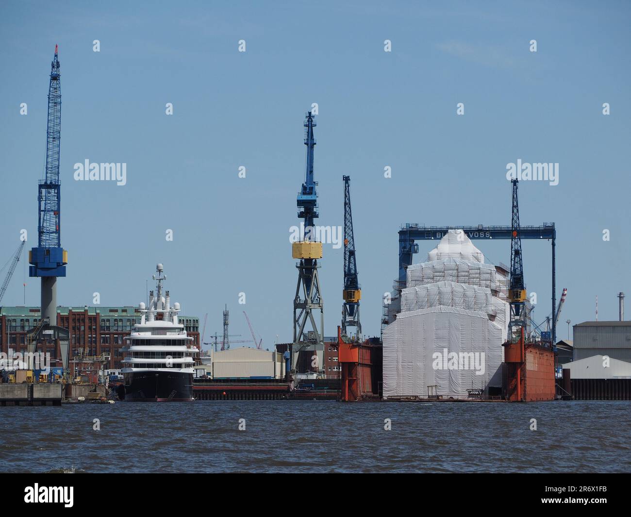 Blohm und Voss shipyards near the city centre of Hamburg, Germany with on the left a superyacht that belonged to Roman Abramovich. Stock Photo
