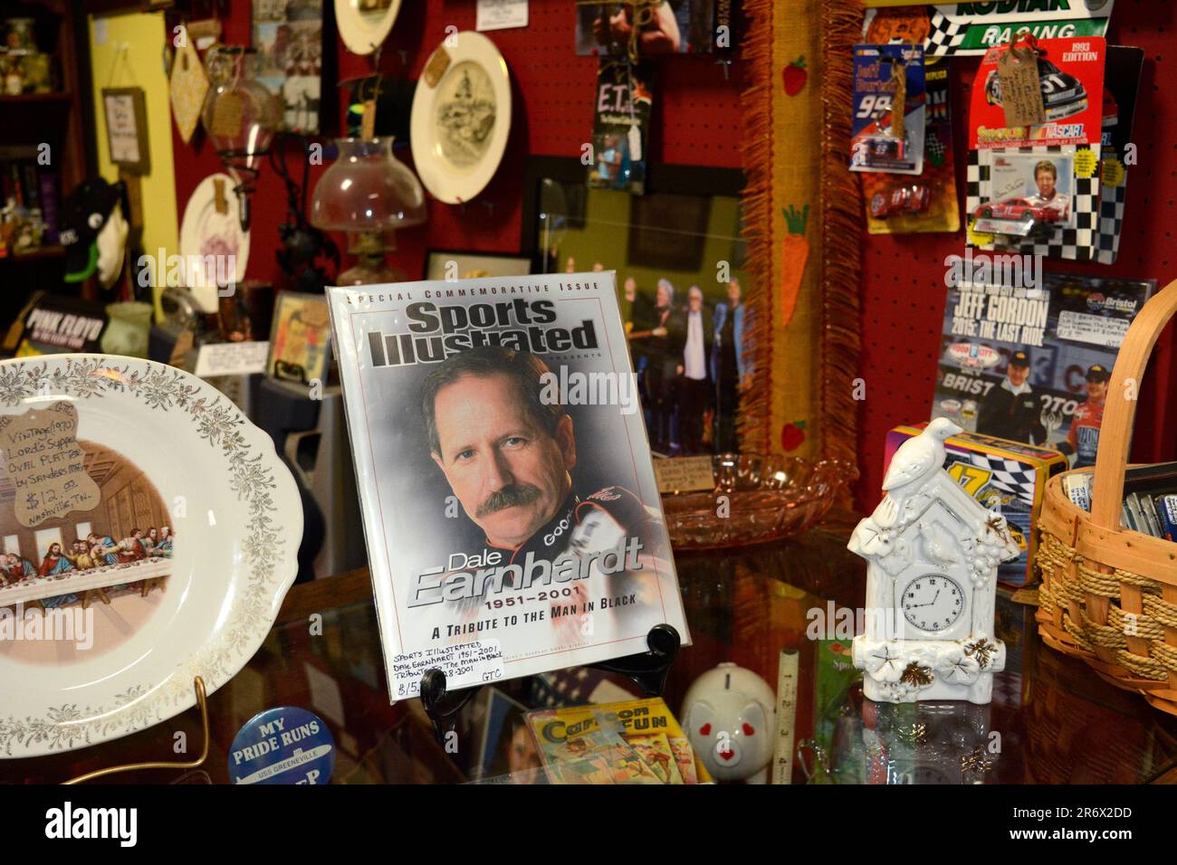 A 2001 commemorative issue of Sports Illustrated magazine featuring NASCAR driver Dale Earnhardt Sr. for sale in an antique shop in Bridstol, Virginia Stock Photo