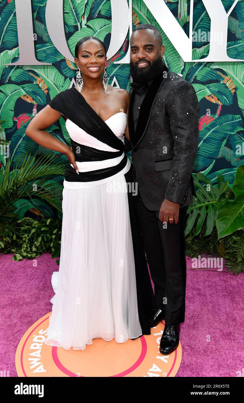 Kandi Burruss, left, and Todd Tucker arrive at the 76th annual Tony