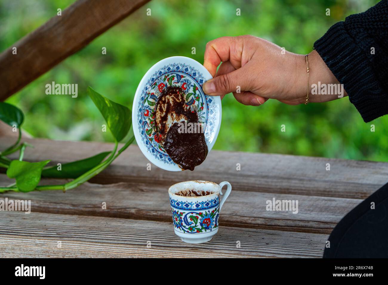 Coffee fortune telling in a classic patterned Turkish cup. Coffee