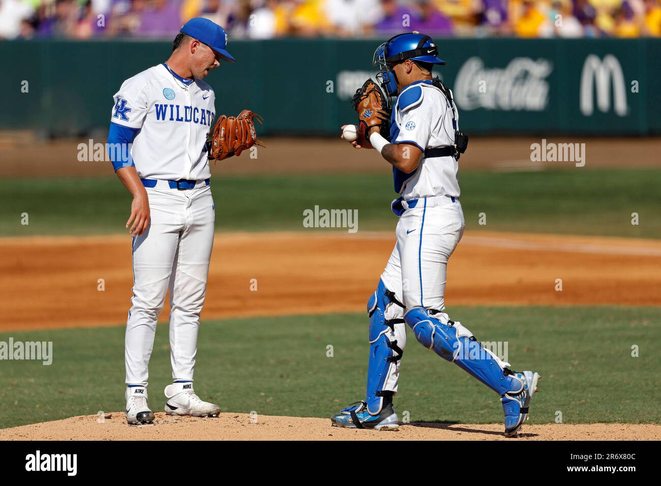 Kentucky pitcher Austin Strickland (16) speaks with Kentucky catcher