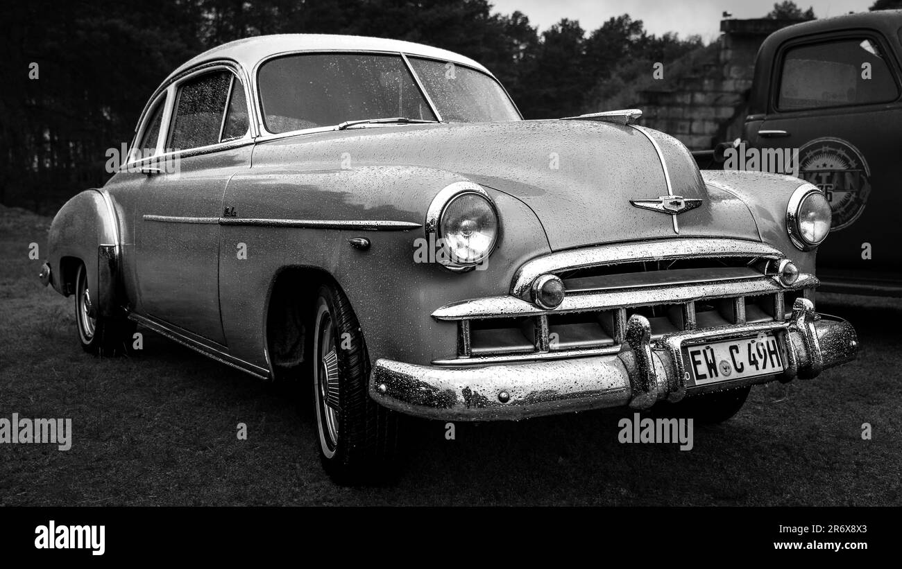 FINOWFURT, GERMANY - MAY 06, 2023: The mid-size car Chevrolet Styleline De Luxe in drops of rain. Black and white. Race festival 2023. Season opening. Stock Photo