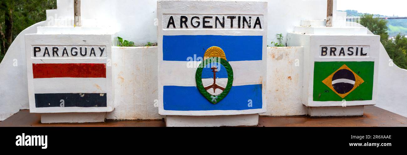 Argentina, Brazil, Paraguay Country Symbols Stone Monument. Famous Triple Frontier (Hito Tres Fronteras) International Border Landmark, Puerto Iguazu Stock Photo