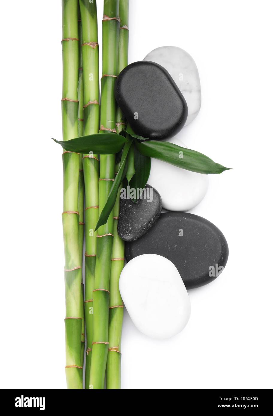 Spa stones and bamboo on white background, top view Stock Photo - Alamy