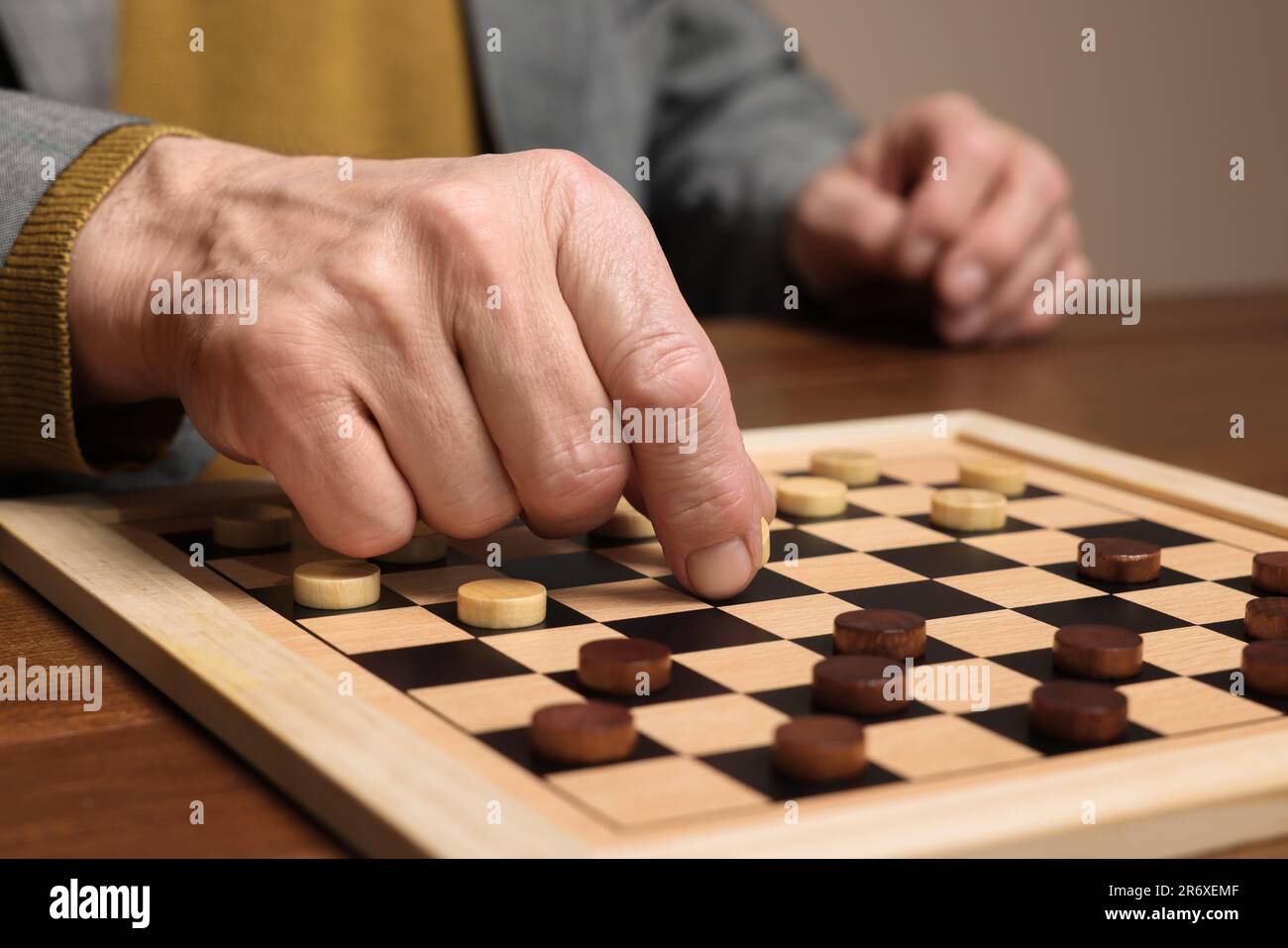 Senior man thinking about his next move in a game of chess Stock Photo by  dmytros9