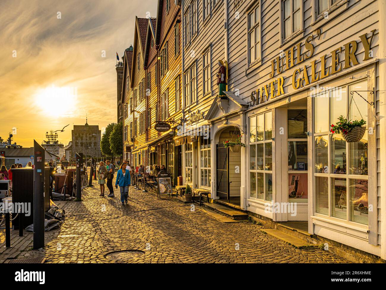 Sunset at Bryggen in Bergen, Norway. Bryggen is on the Unesco World Heritage list  and consists of very old wooden buildings from the Middle Ages. Stock Photo