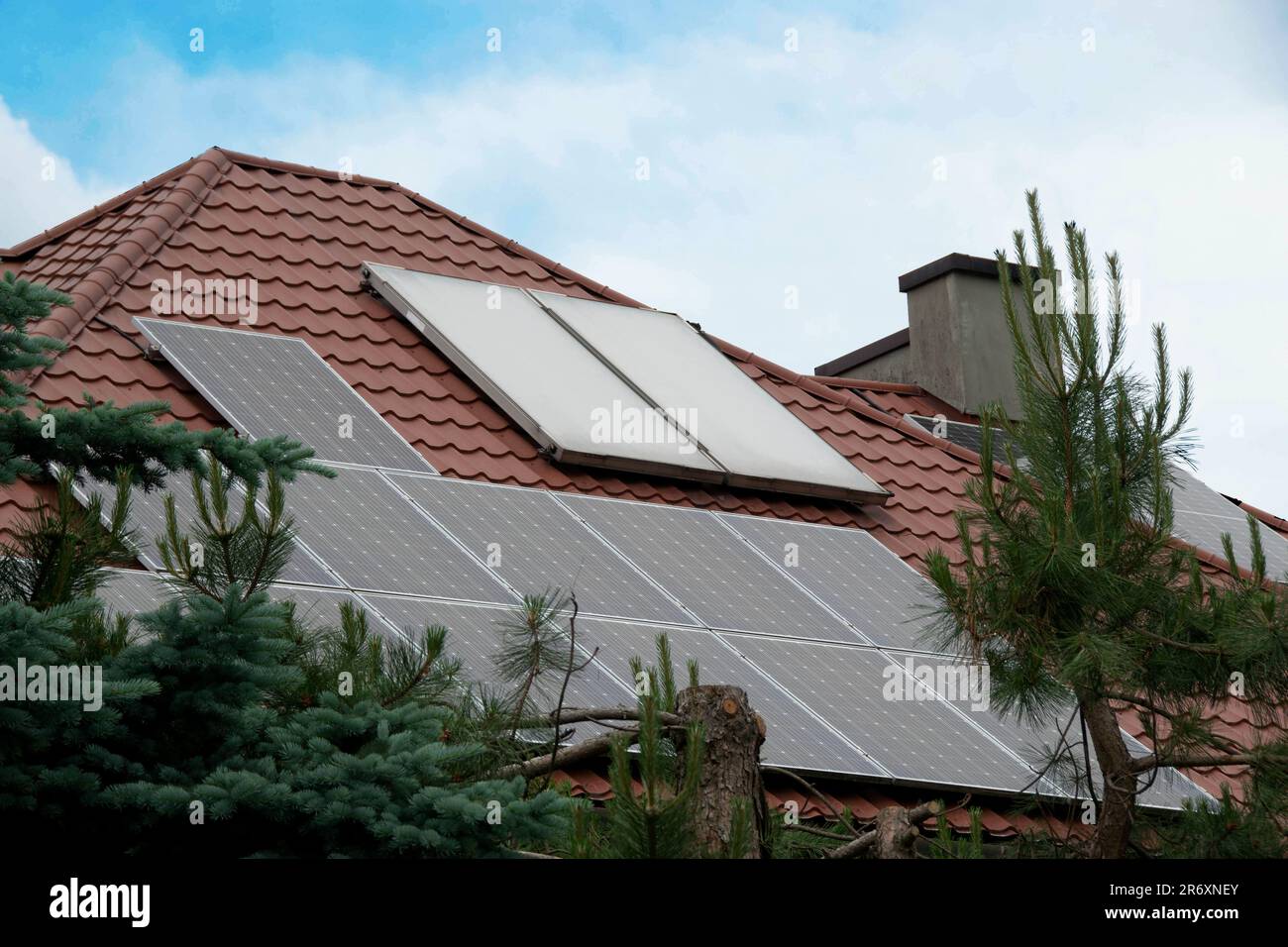 Picture of Installing a Solar Cell on a Roof. Solar panels on roof. Historic farm ...