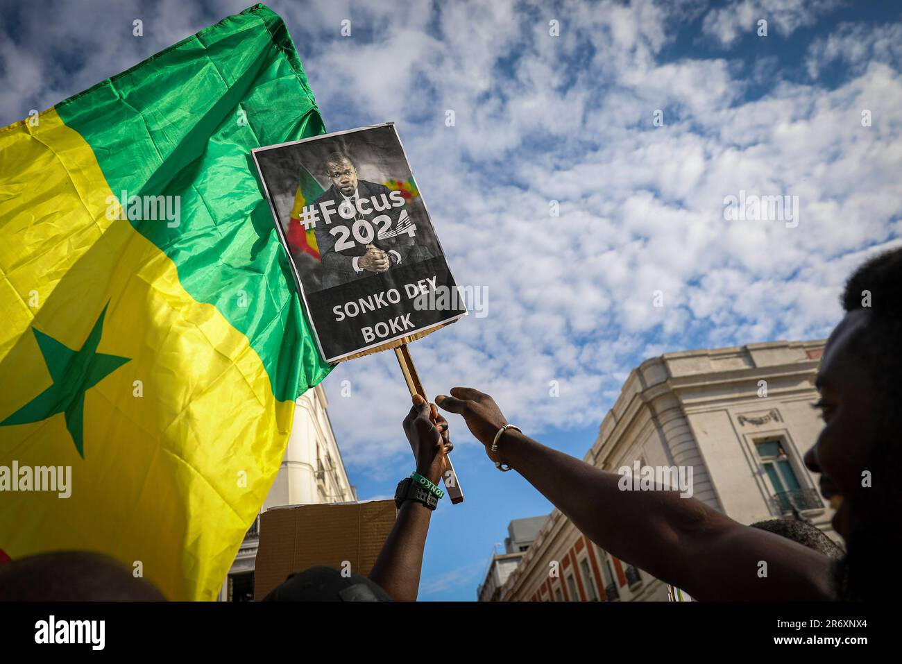 Madrid, Spain. 11th June, 2023. A protester holds a placard in support of  Senegalese opposition leader Ousmane Sonko during the demonstration.  Senegalese residing in Madrid gathered at Madrid's Puerta del Sol to