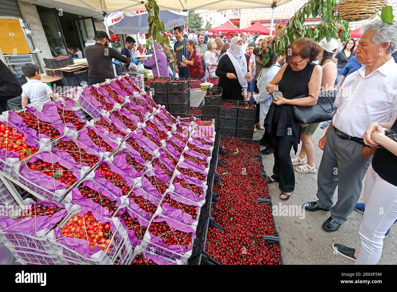 Hammana, Lebanon. 11th June, 2023. People visit a fruit stall on Cherry Day in the town of