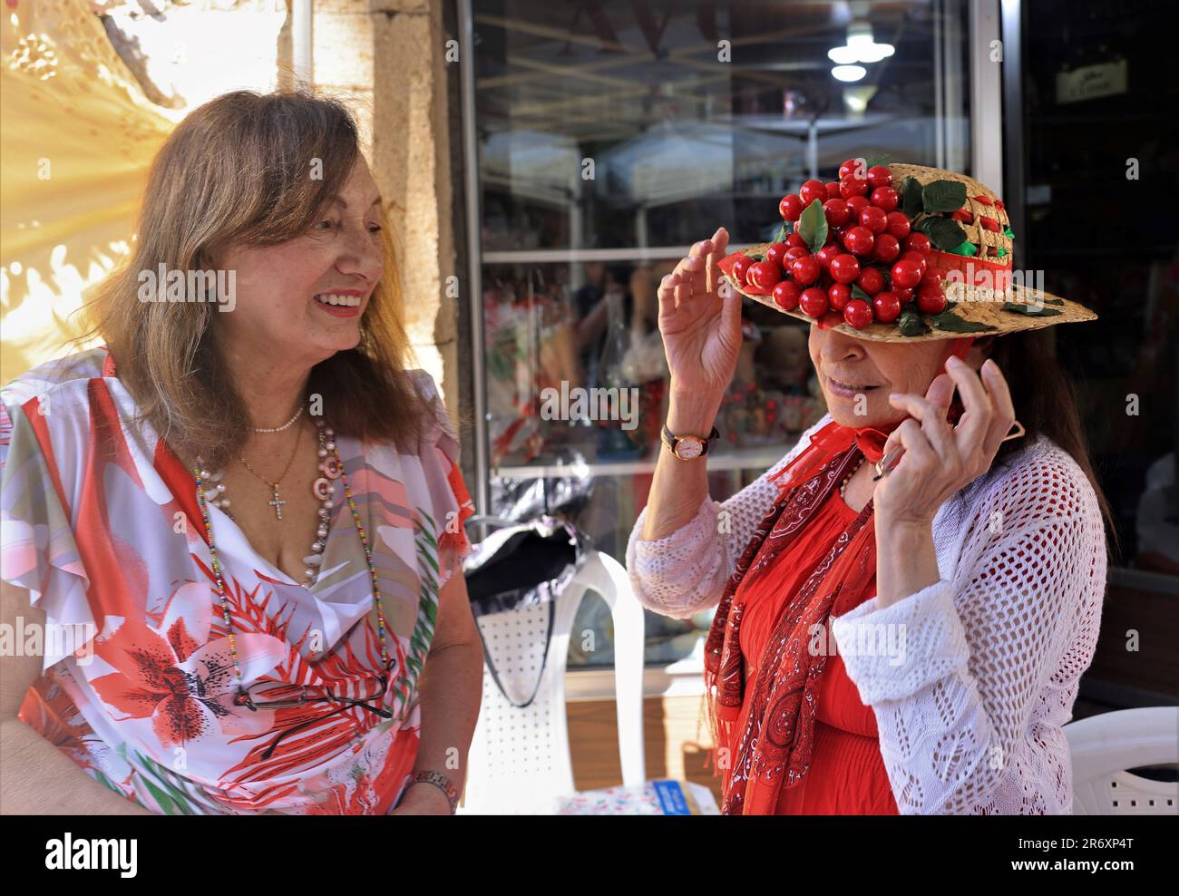 Hammana, Lebanon. 11th June, 2023. Two women chat on Cherry Day in the town of Hammana, Lebanon