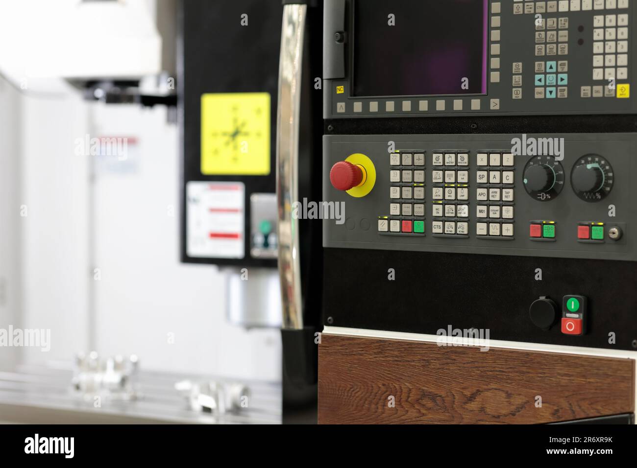 Control console of vertical CNC milling machine. Selective focus. Stock Photo