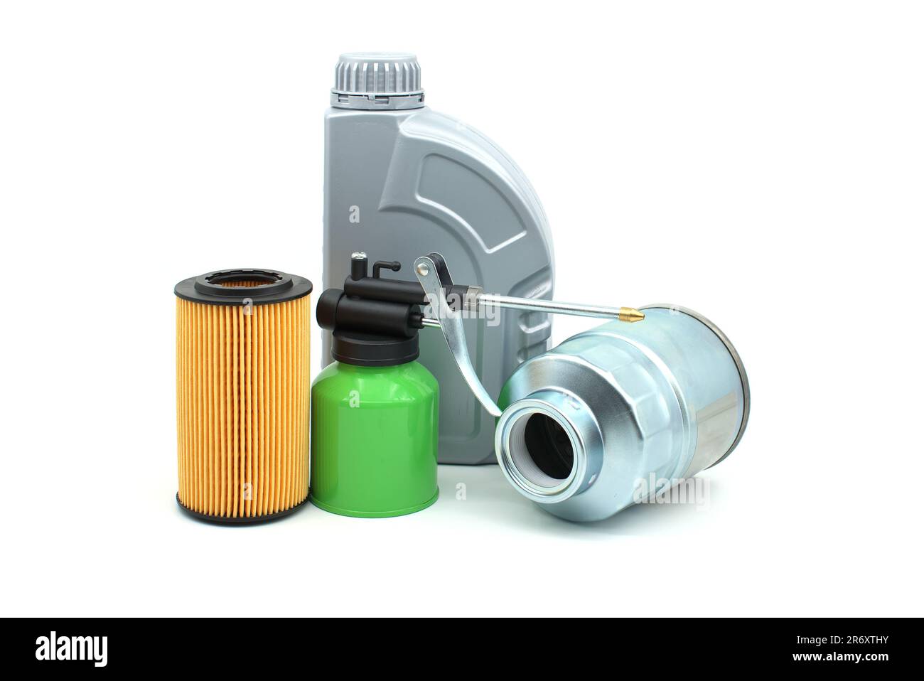 Motor oil filters, hand pump oiler and oil container isolated on a white background. Oil and