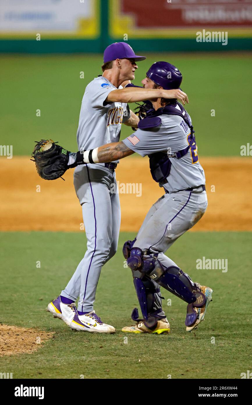 LSU infielder Gavin Guidry celebrates with catcher Hayden Travinski after defeating Kentucky in