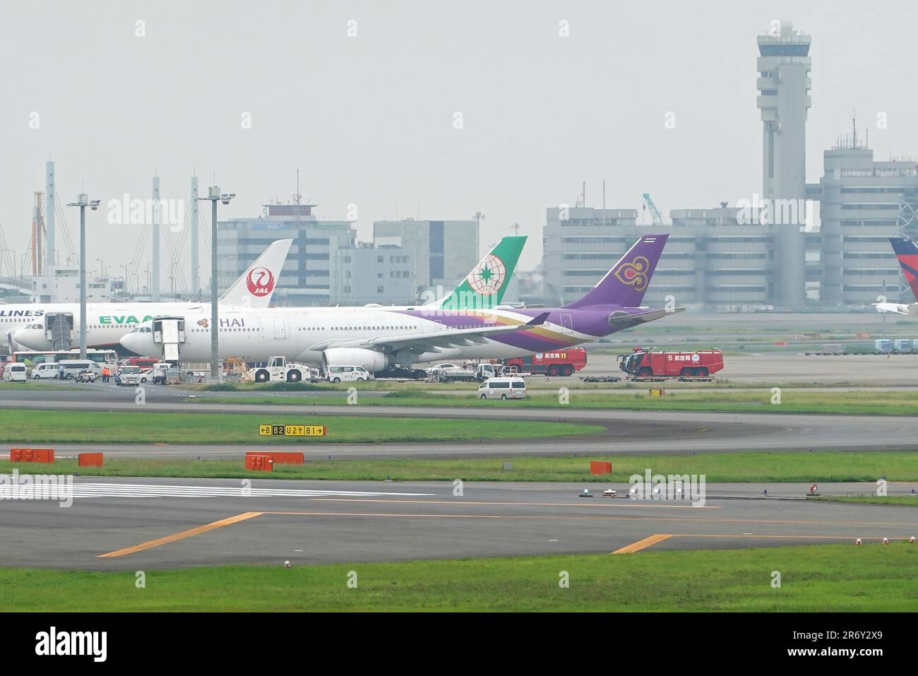Thai Airways Flight TG683 (third from left, A330-300, Reg, HS-TEO) after contact with EVA Air Flight BR189 (second from left, A330-300, Reg. B-16340) at Haneda Airport, on June 10, 2023. (Photo by Tadayuki YOSHIKAWA/Aviation Wire) Stock Photo