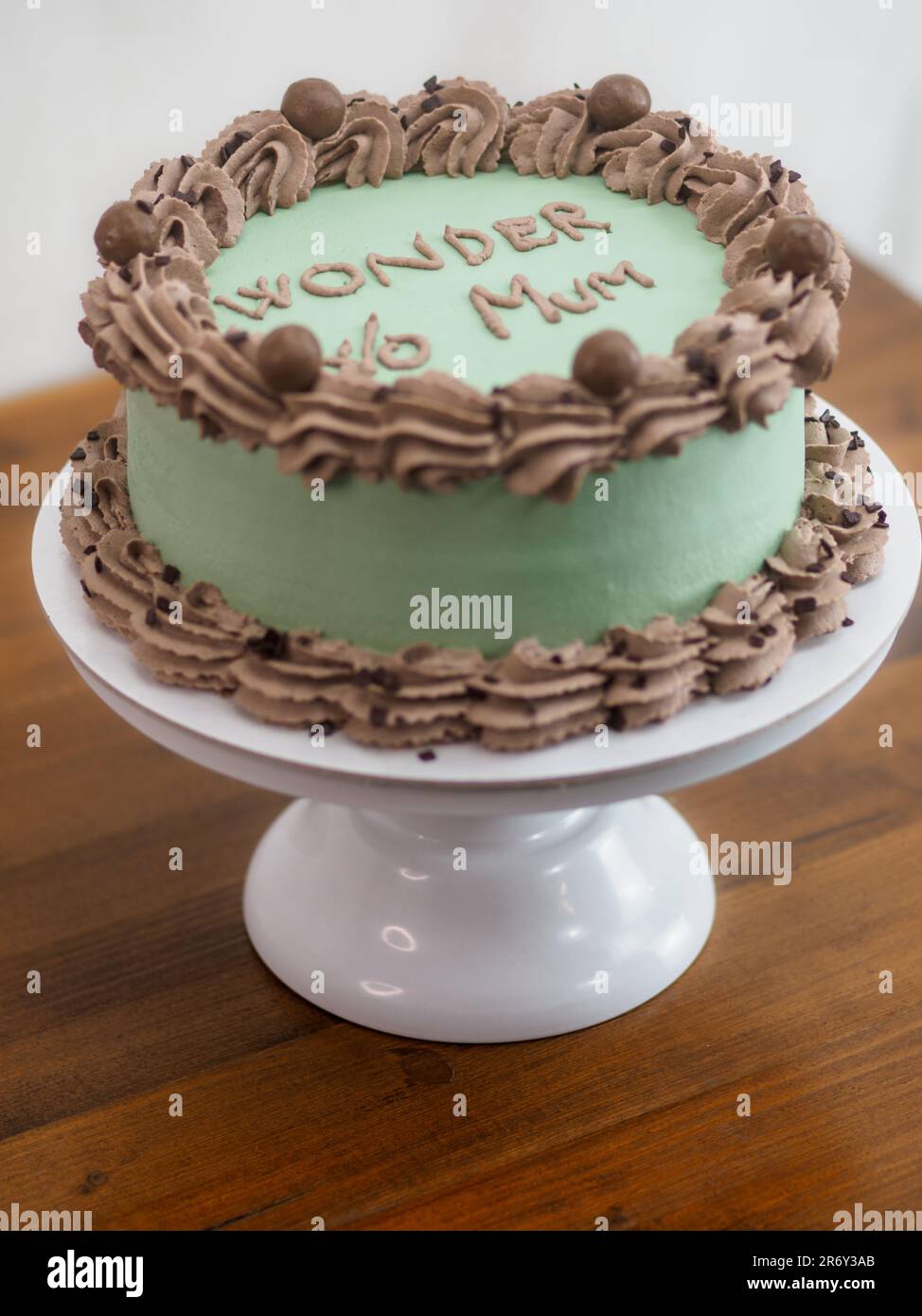 frosted icing elegnt cake with funny lettering topping. Mothers day ...