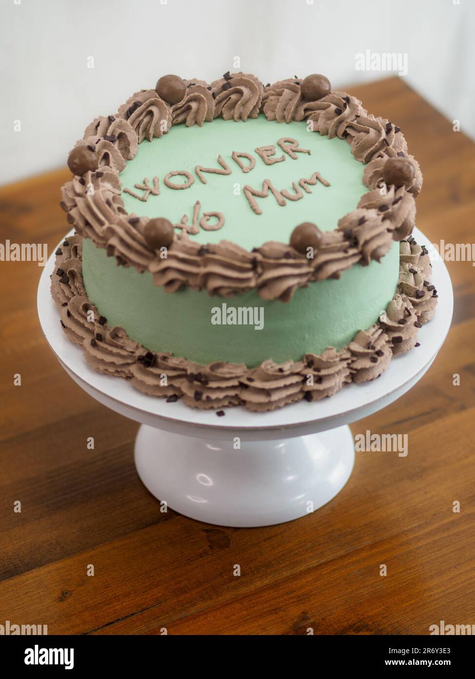 frosted icing elegnt cake with funny lettering topping. Mothers day ...
