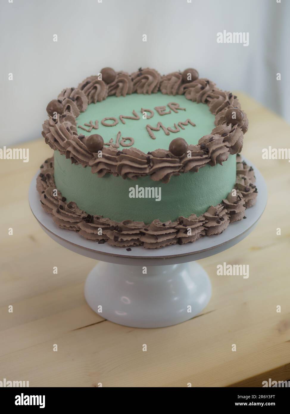 frosted icing elegnt cake with funny lettering topping. Mothers day ...