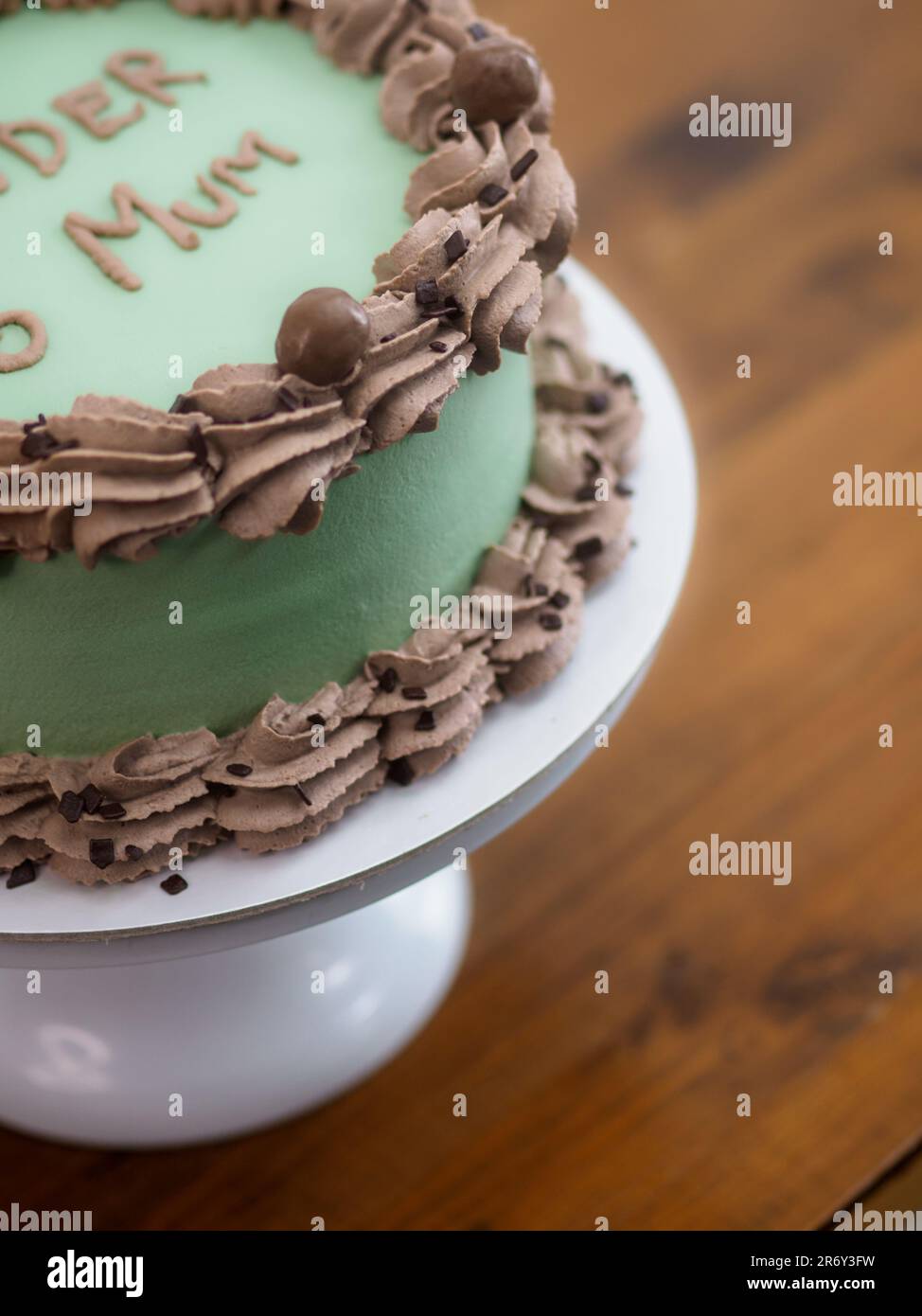 frosted icing elegnt cake with funny lettering topping. Mothers day ...