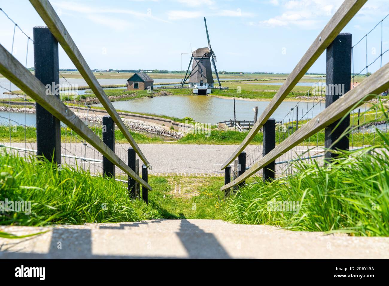 On a sunny day at the mill of the North on the island of Texel in the Netherlands Stock Photo