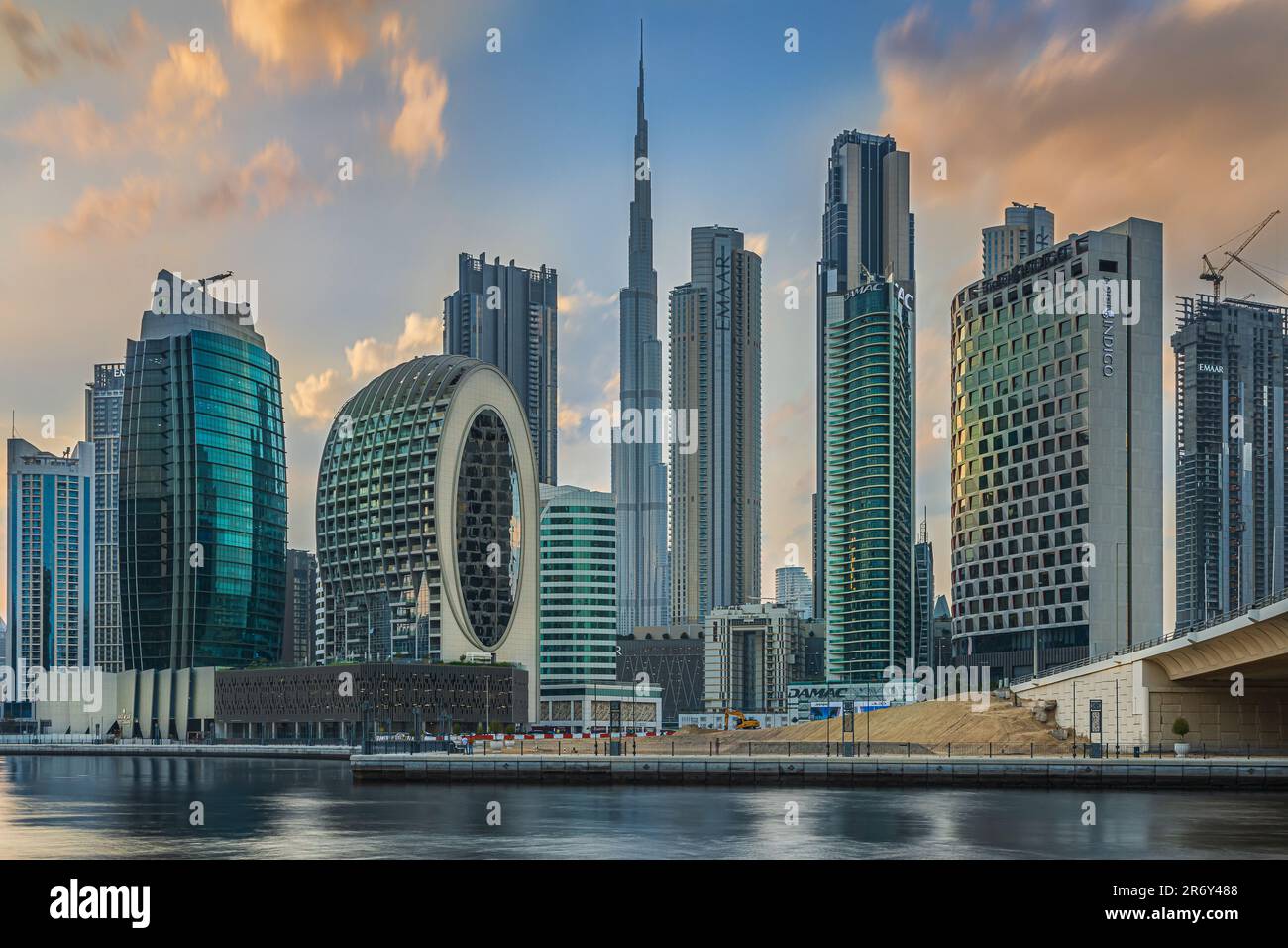 Skyscrapers of Dubai skyline. cloudy sky over the Arabian city. sunset with high-rise buildings in the Emirates with a view of Burj Khalifa. Stock Photo