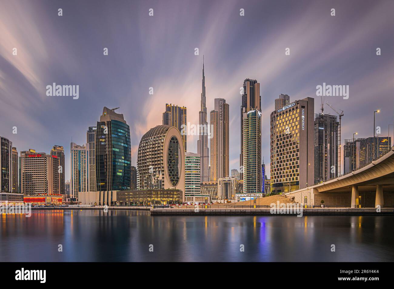Dubai in the evening after sunset. United arab emirates city skyline. High-rise buildings with lighting. City center view Reflection of the city light Stock Photo