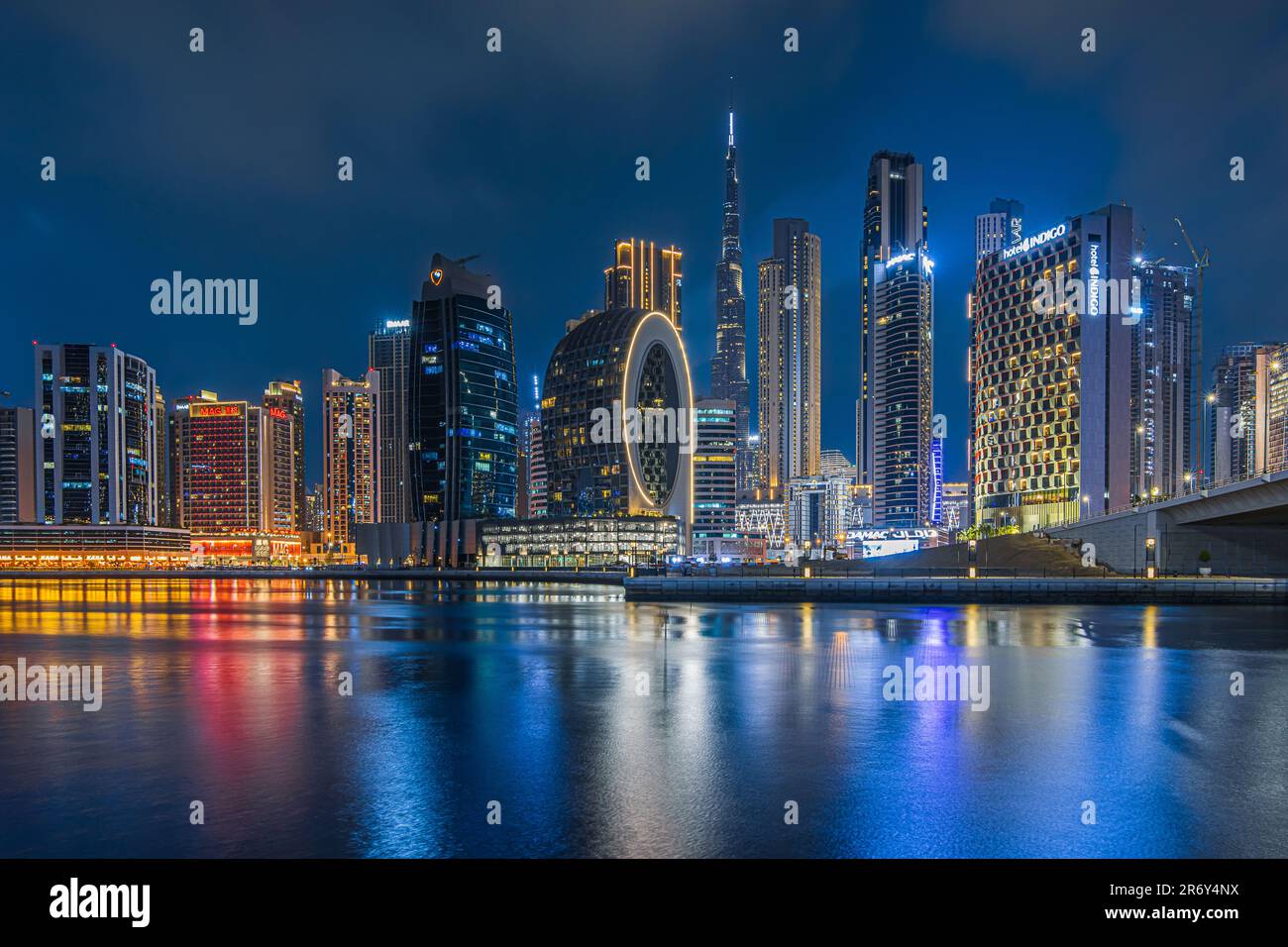 Skyline of Dubai in the evening at the blue hour. illuminated office and commercial buildings from the financial center of the city in the united arab Stock Photo