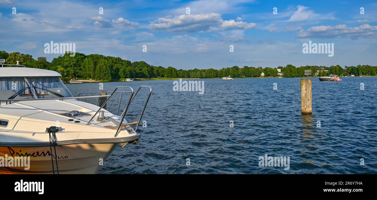 Bad Saarow, Germany. 11th June, 2023. The evening sun shines over Lake Scharmützel. The body of water in the Oder-Spree district, about 50 kilometers southeast of Berlin, is the largest lake in Brandenburg with about 1,500 hectares of water surface. The writer Theodor Fontane called the lake the Märkisches Meer. Credit: Patrick Pleul/dpa/Alamy Live News Stock Photo