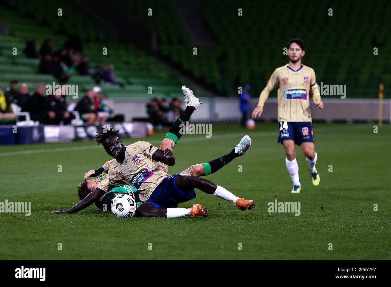 MELBOURNE, AUSTRALIA - APRIL 26: Valentino Yuel of Newcastle Jets and Alessandro Diamanti of Western United clash during the Hyundai A-League soccer match between Western United FC and Newcastle Jets on April, 26, 2021 at AAMI Park in Melbourne, Australia. Stock Photo