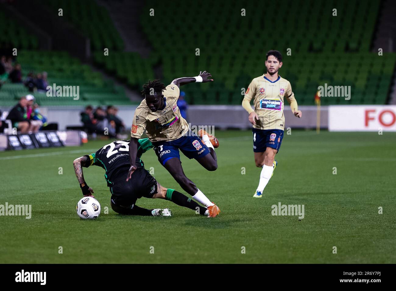 MELBOURNE, AUSTRALIA - APRIL 26: Valentino Yuel of Newcastle Jets and Alessandro Diamanti of Western United clash during the Hyundai A-League soccer match between Western United FC and Newcastle Jets on April, 26, 2021 at AAMI Park in Melbourne, Australia. Stock Photo