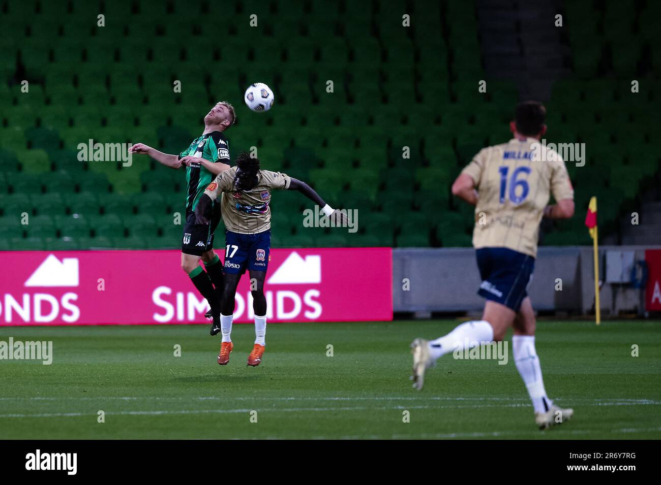 MELBOURNE, AUSTRALIA - APRIL 26: Connor Pain of Western United heads the ball ahead of Valentino Yuel of Newcastle Jets during the Hyundai A-League soccer match between Western United FC and Newcastle Jets on April, 26, 2021 at AAMI Park in Melbourne, Australia. Stock Photo