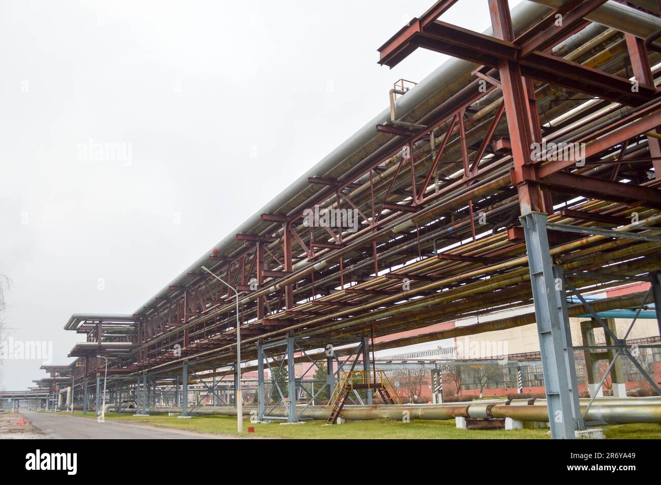 Industrial trestle for pipes. Iron pipes in the oil refinery ...