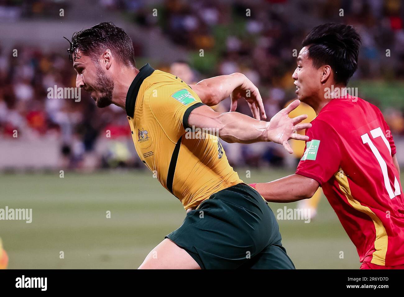 Van Thanh Vu of Vietnam and Matthew Leckie of the Australian Socceroos contests the ball during the World Cup Qualifier football match between Australia Socceroos and Vietnam on January 27, 2022 at AAMI Park in Melbourne, Australia. Stock Photo