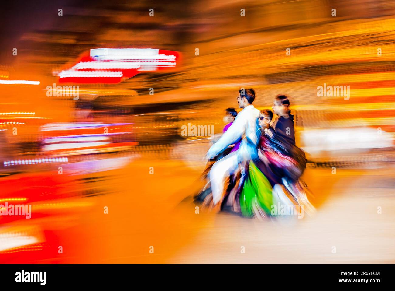 New Delhi, India - November 10, 2011:  motorbike driving in blurred motion by night in Chandni Chowk. The Chandni Chowk is one of the oldest and busie Stock Photo