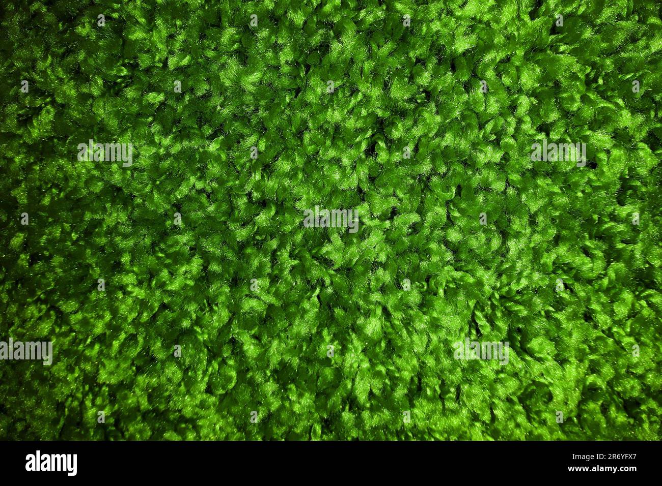 plastic green grass carpet texture as very nice background Stock Photo