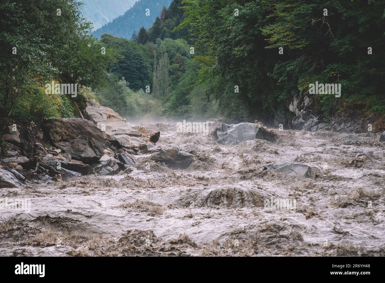 Flooded river in the mountain valley Stock Photo - Alamy
