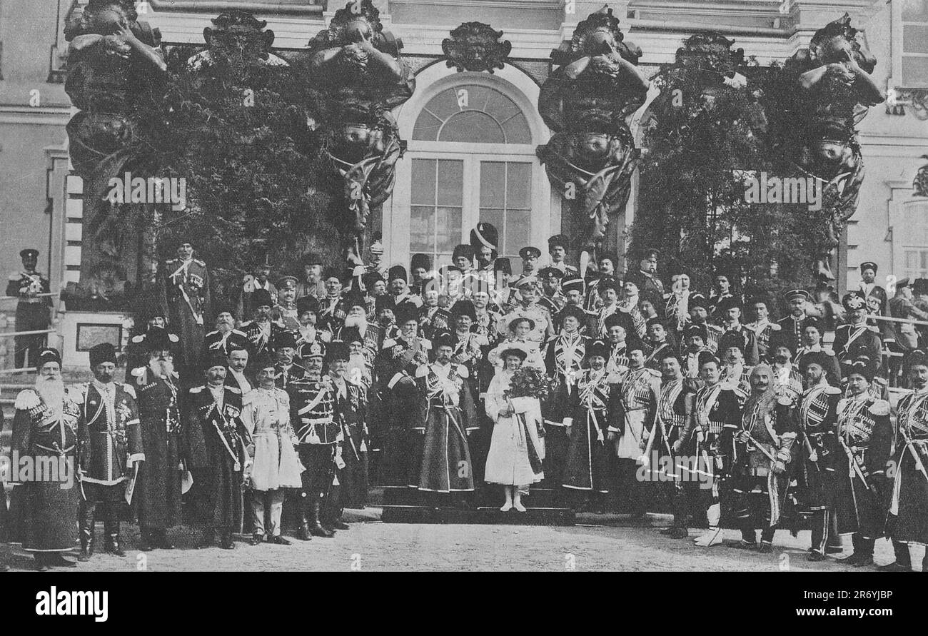 Russian Emperor Nicholas II with family members among the various ranks of His Majesty's Own Escort in the historical forms of the escort. Photo taken in 1911. Stock Photo
