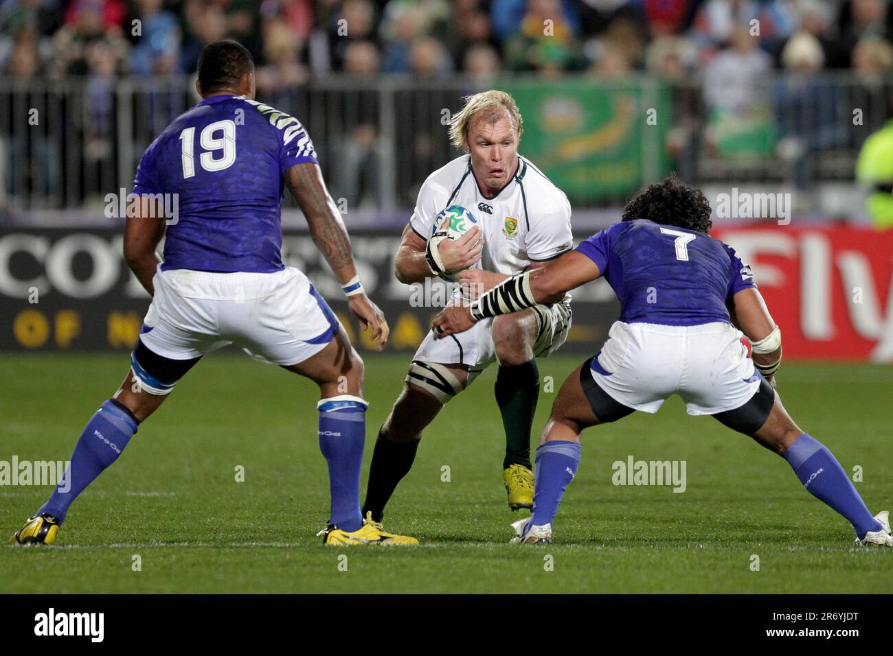 South Africa’s Schalk Burger is about to be challenged by Samoa’s Joe Tekori and Maurie Faasavalu during a Pool D match of the Rugby World Cup 2011, North Harbour Stadium, Auckland, New Zealand, Friday, September 30, 2011. Stock Photo