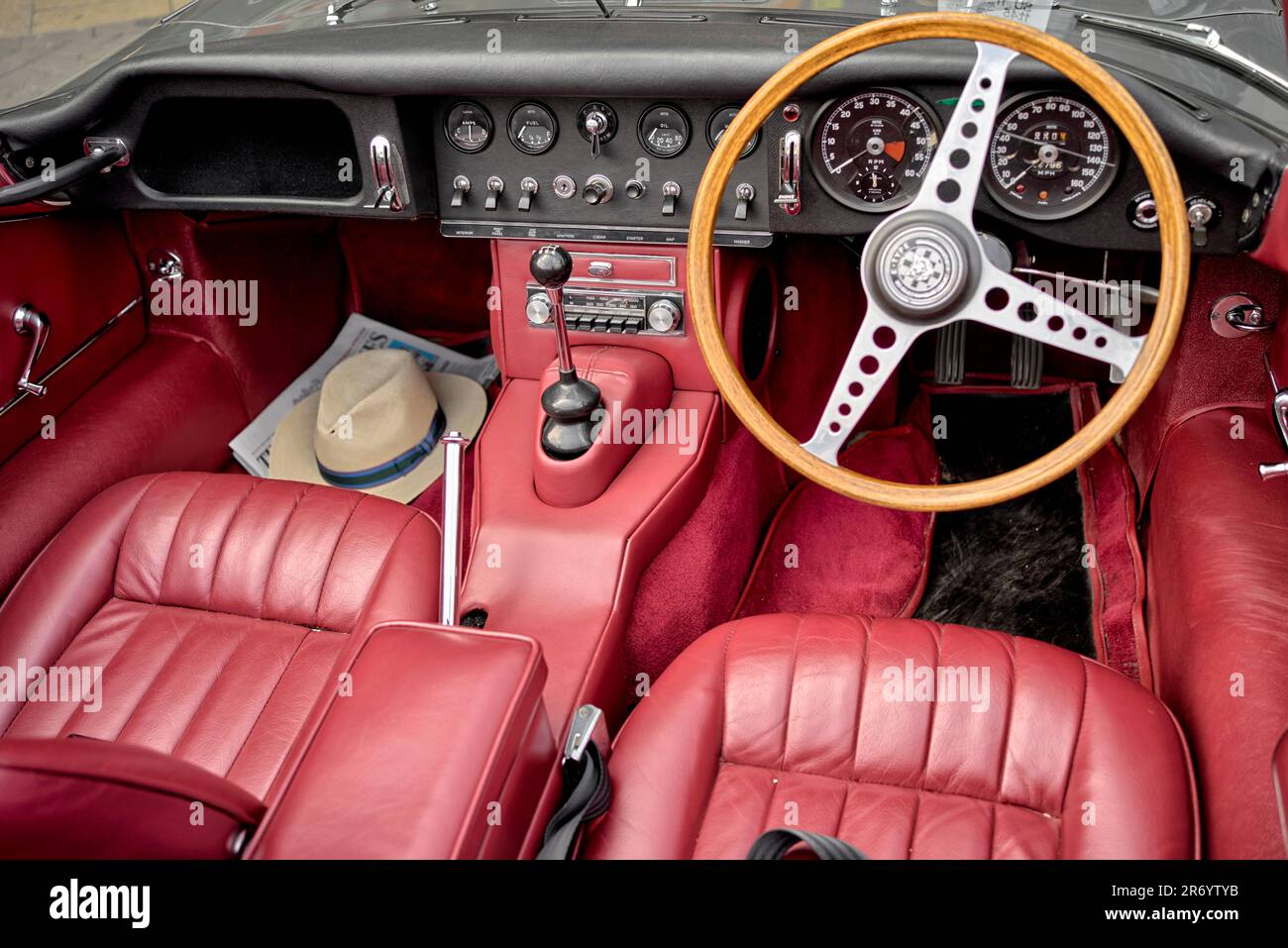 Jaguar E Type interior, red leather, 1965 4.2 litre convertible. Iconic English sports car. Stock Photo