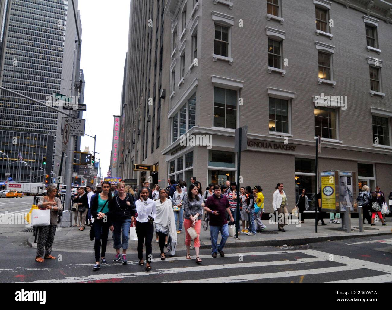 Pedestrians crossing 49th street along the 6th Avenue in Manhattan, New York City, NY, USA. Stock Photo