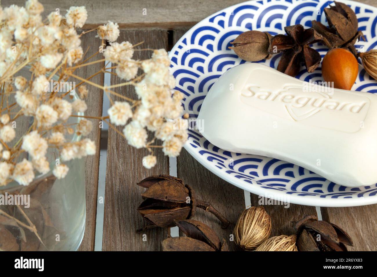 Ho Chi Minh City, Vietnam - June 11, 2023: Safeguard logo imprinted on a bar of antibacterial hand soap. Hygiene product of a popular brand on a woode - Stock Image