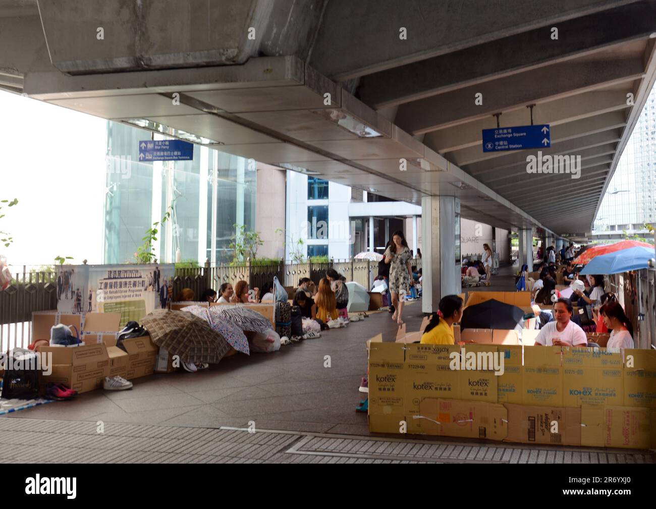Filipino domestic helpers enjoying their Sunday ( day off ) in Hong Kong Central district. Stock Photo