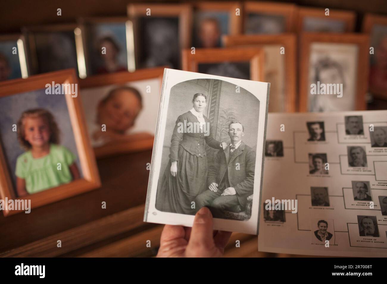 Photographs, old and current, are displayed in the home of an Idaho family. Stock Photo