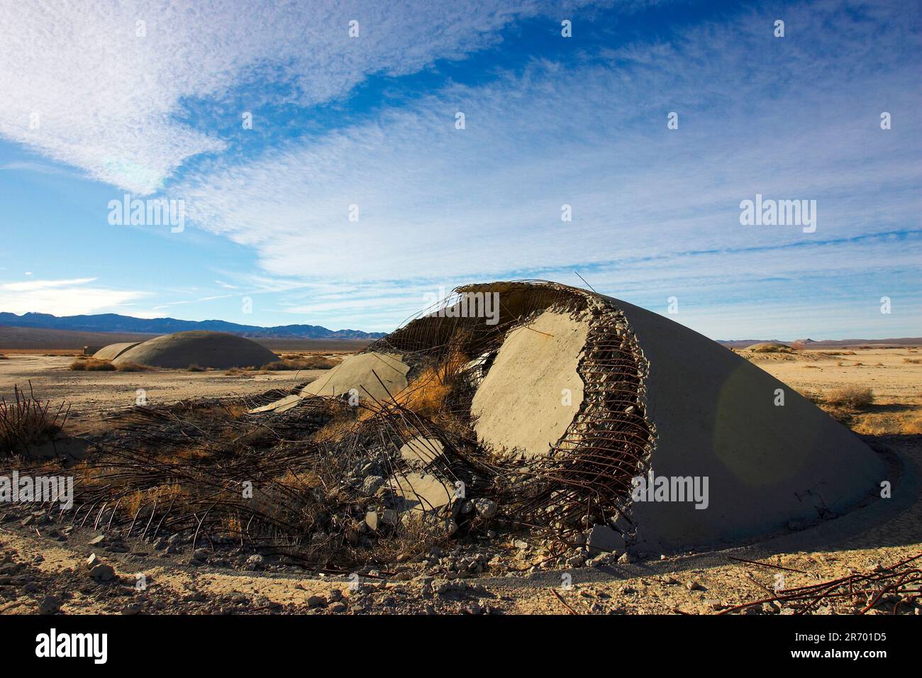 Twisted and bent metal from the steel and concrete bunkers that once stood in Frenchman Flat at the Nevada Test Site. Stock Photo