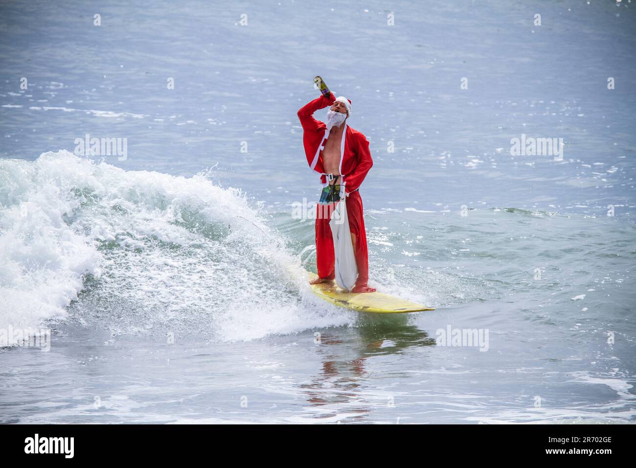 Surf in a carnival costumes, Bali, Indonesia. Stock Photo