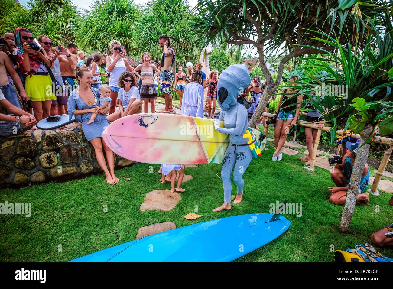 Surf in a carnival costumes, Bali, Indonesia. Stock Photo