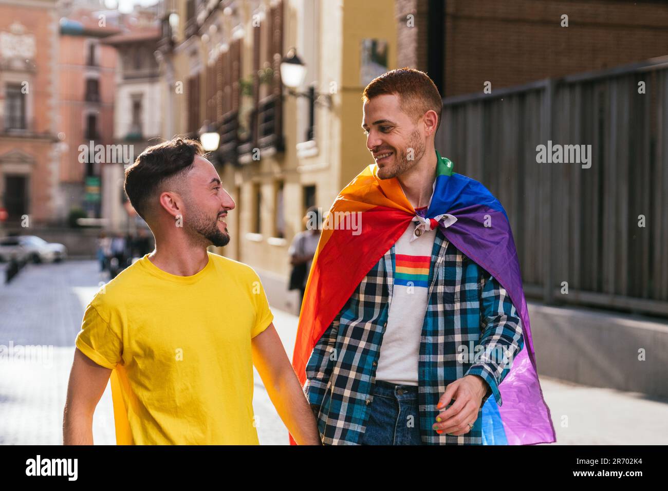 Gay Friends Embracing, Celebrating LGBTQ with Pride Accessories Stock Photo  - Alamy