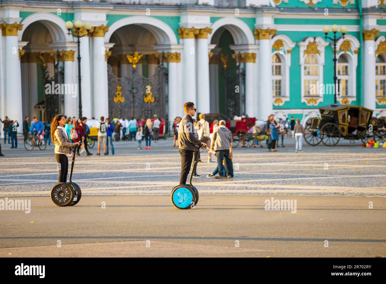 People Using Segways At Palace Square In Saint Petersburg, Russia Stock Photo